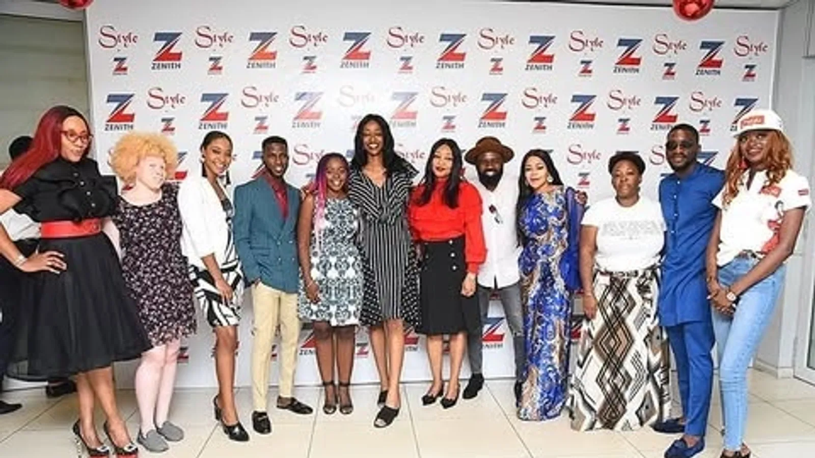 Peach Strides team at a Style by Zenith branded backdrop during a Zenith Bank event